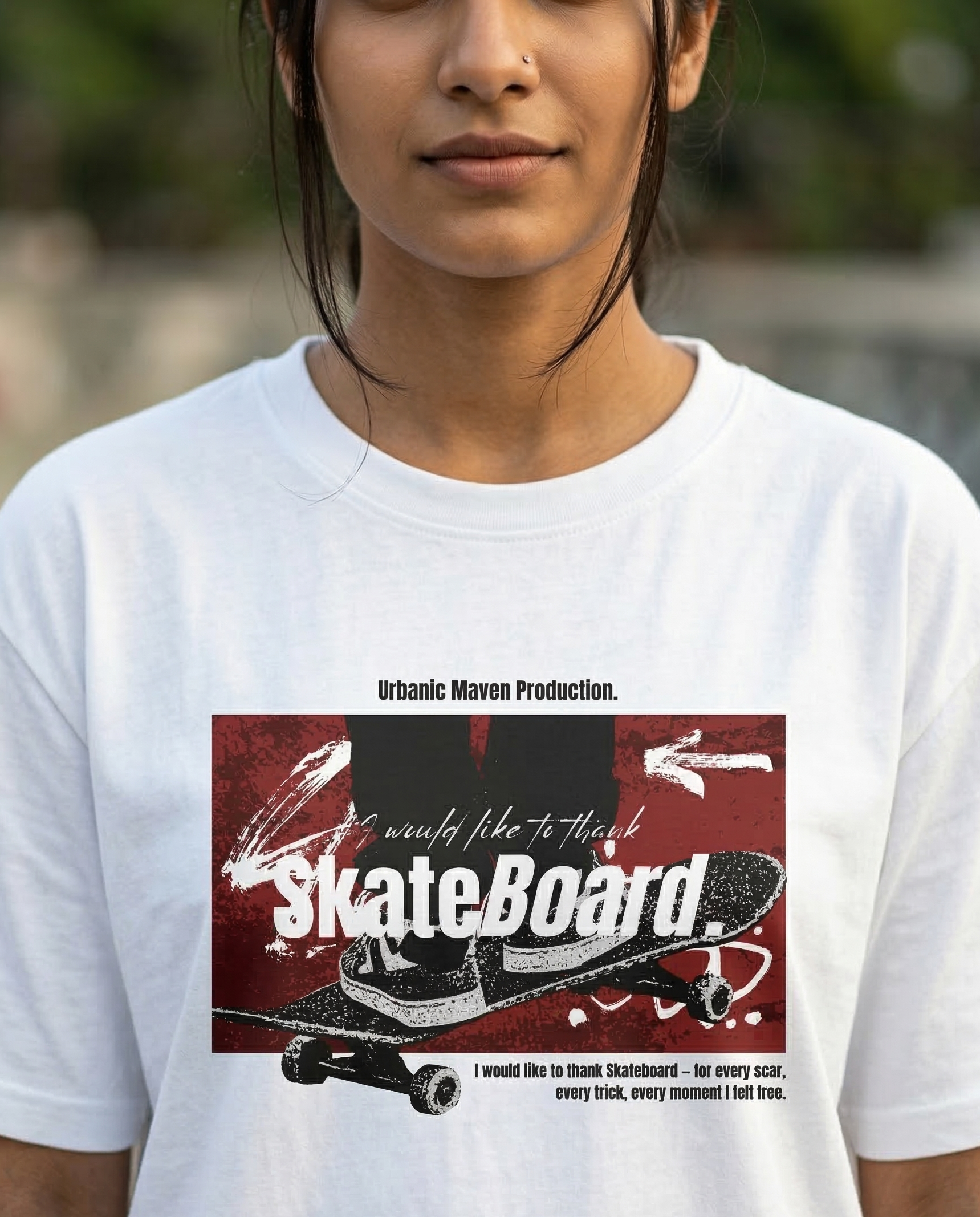 Closeup of a girl wearing a white t-shirt with a graphic design of a skateboard and text.