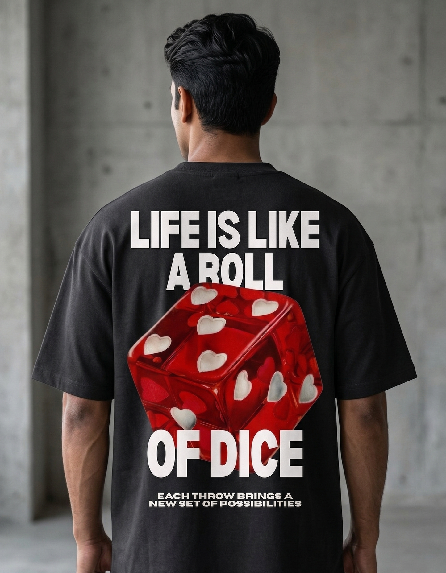 Person wearing a black t-shirt with a dice graphic and text on the back.
