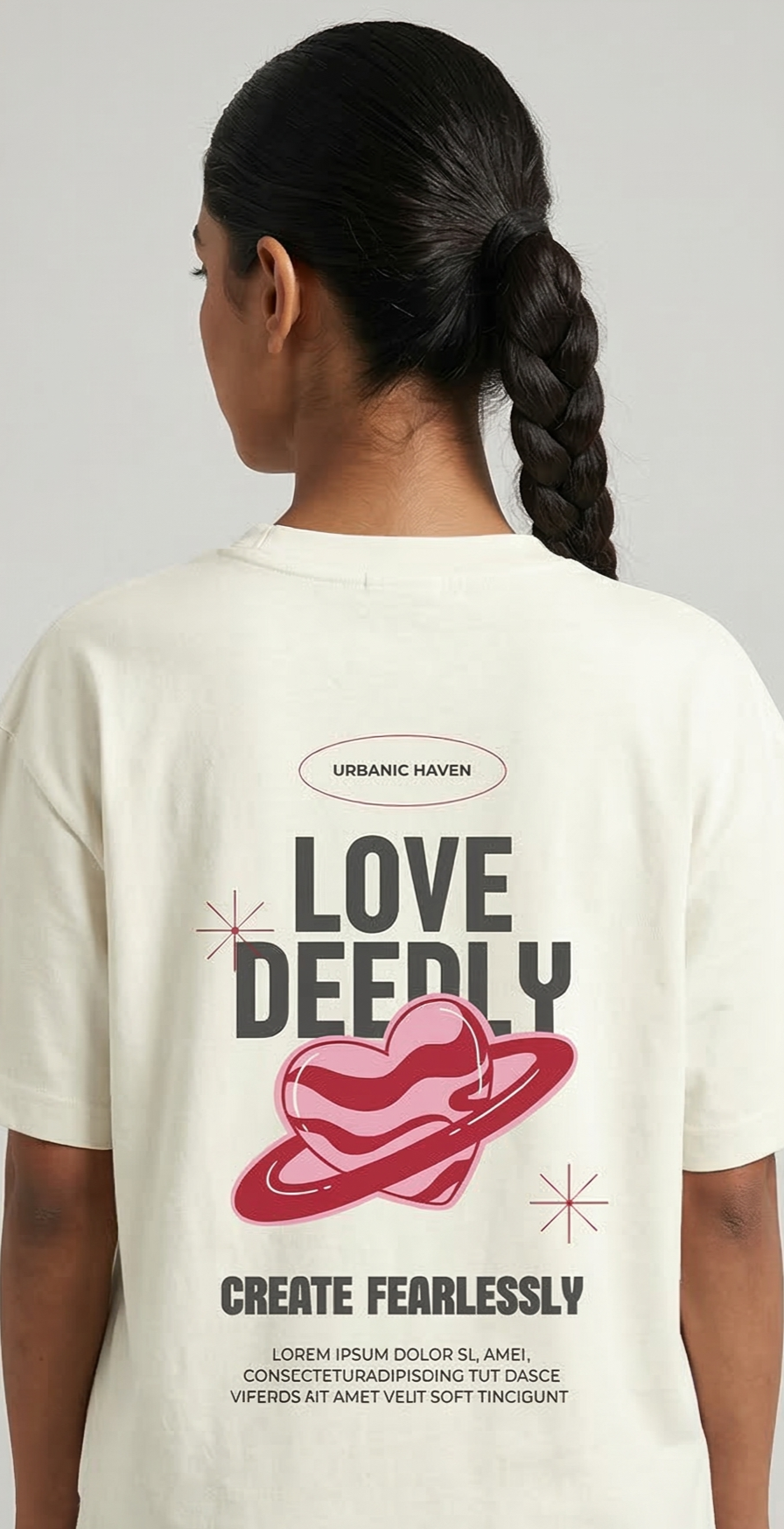 Person wearing a Ivory t-shirt with 'Love Deeply, Create Fearlessly' design on the back.